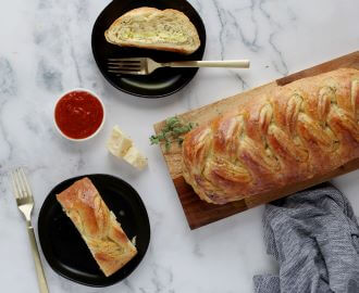 Butter Braid Pastry Four Cheese and Herb pastry with slices on plates